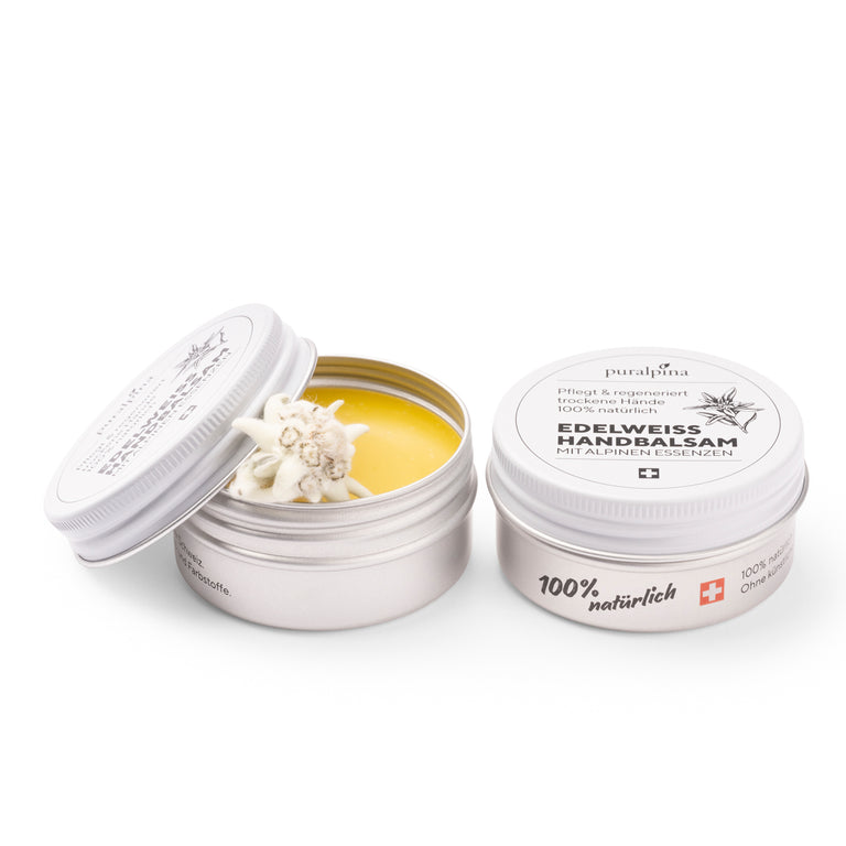 Opened and closed tin of Puralpina Edelweiss Hand Balm with Edelweiss blossom